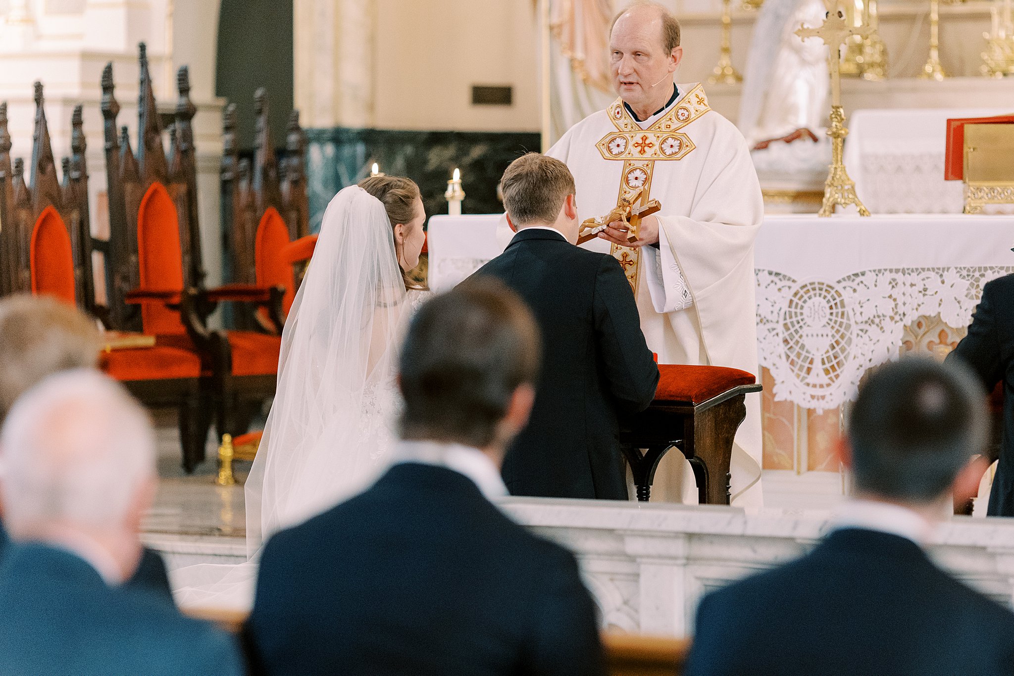 A-Catholic-couple-kisses-the-crucifix-during-the-Croatian-tradition-of-their-catholic-wedding-mass